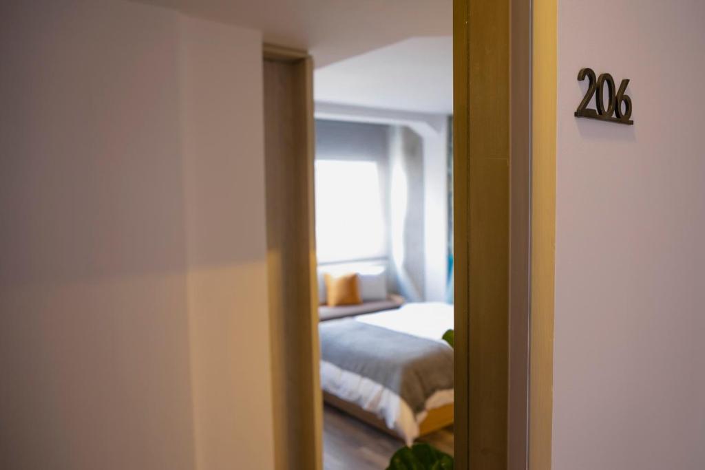 Postel nebo postele na pokoji v ubytování 5Q House Quinta Camacho