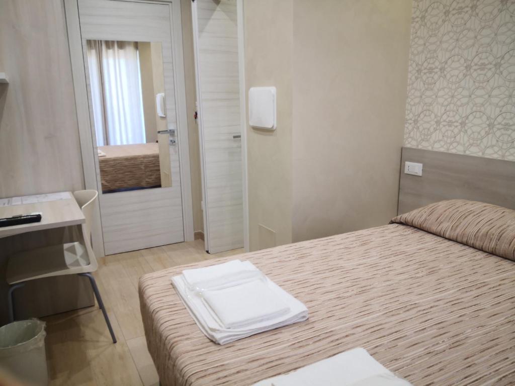 Voodi või voodid majutusasutuse Gidà Room Metro B Monti Tiburtini Roma toas