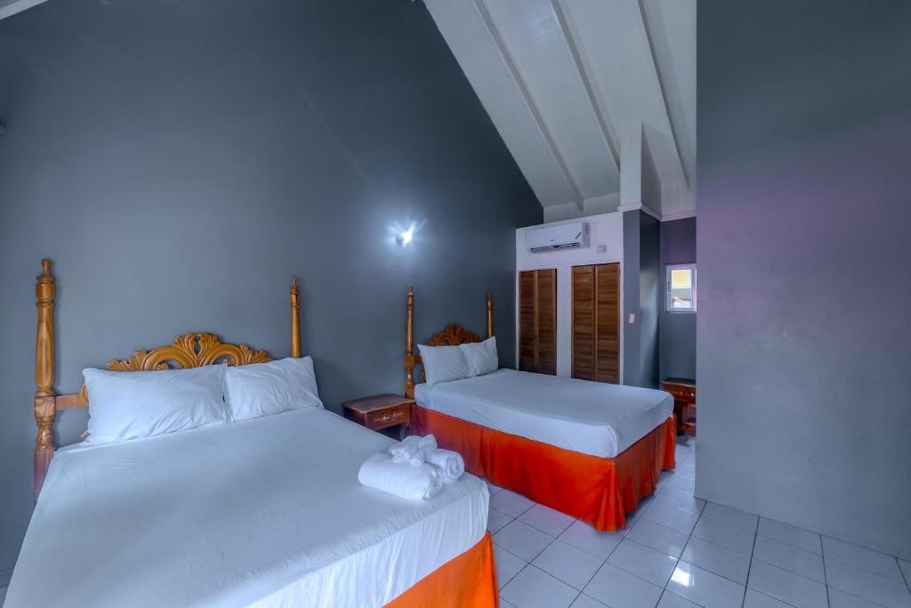 Postel nebo postele na pokoji v ubytování Tamboo Resort