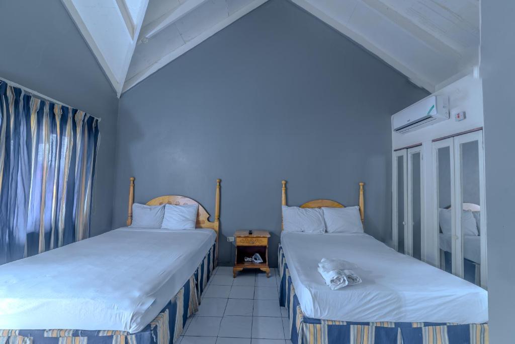 Postel nebo postele na pokoji v ubytování Tamboo Resort