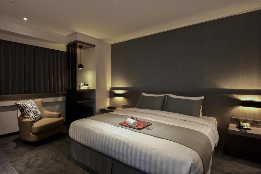 Postel nebo postele na pokoji v ubytování Wonstar Hotel