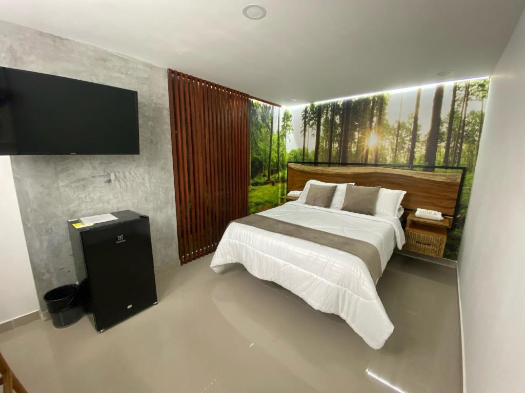 TV a/nebo společenská místnost v ubytování Maidy Luxury Hotel