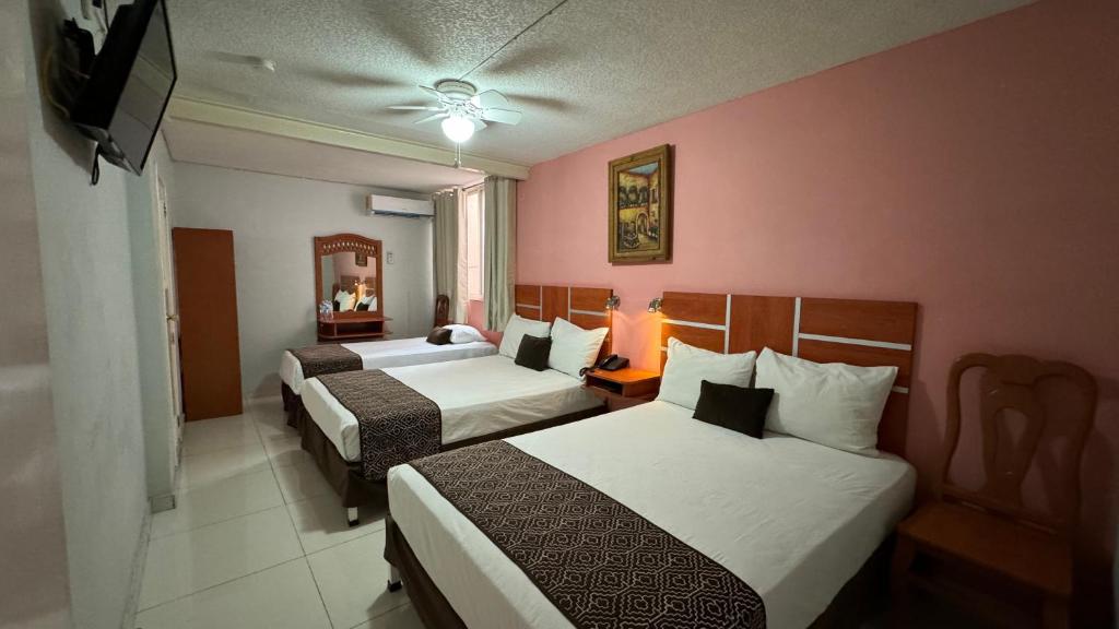 Postel nebo postele na pokoji v ubytování Hotel Ana Isabel
