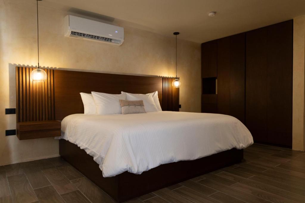Postel nebo postele na pokoji v ubytování Moreira Hotel Boutique