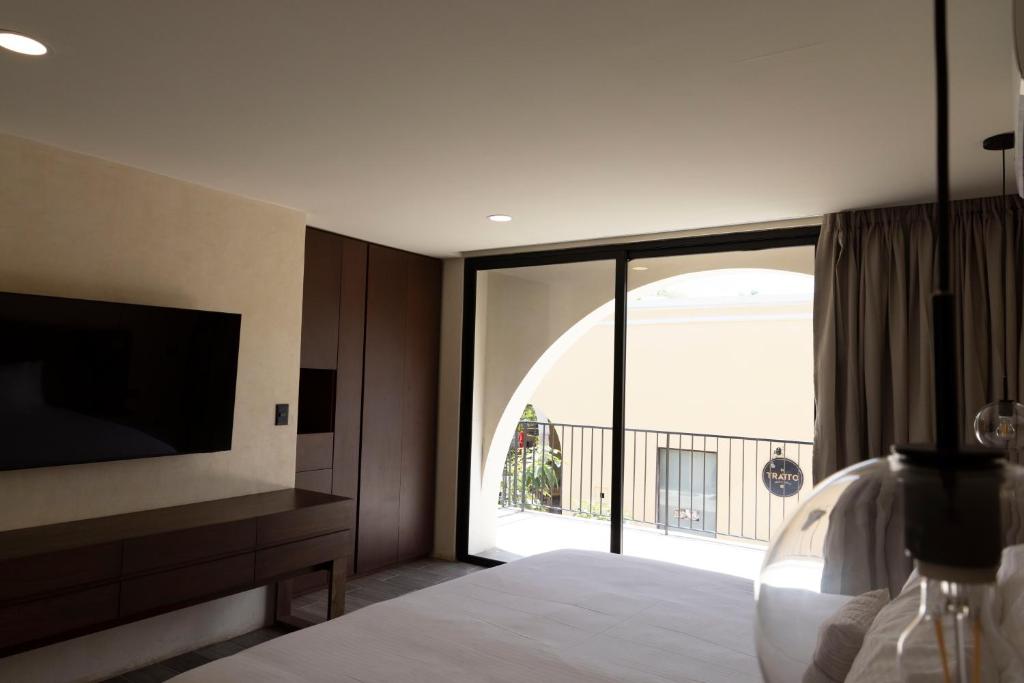 TV a/nebo společenská místnost v ubytování Moreira Hotel Boutique
