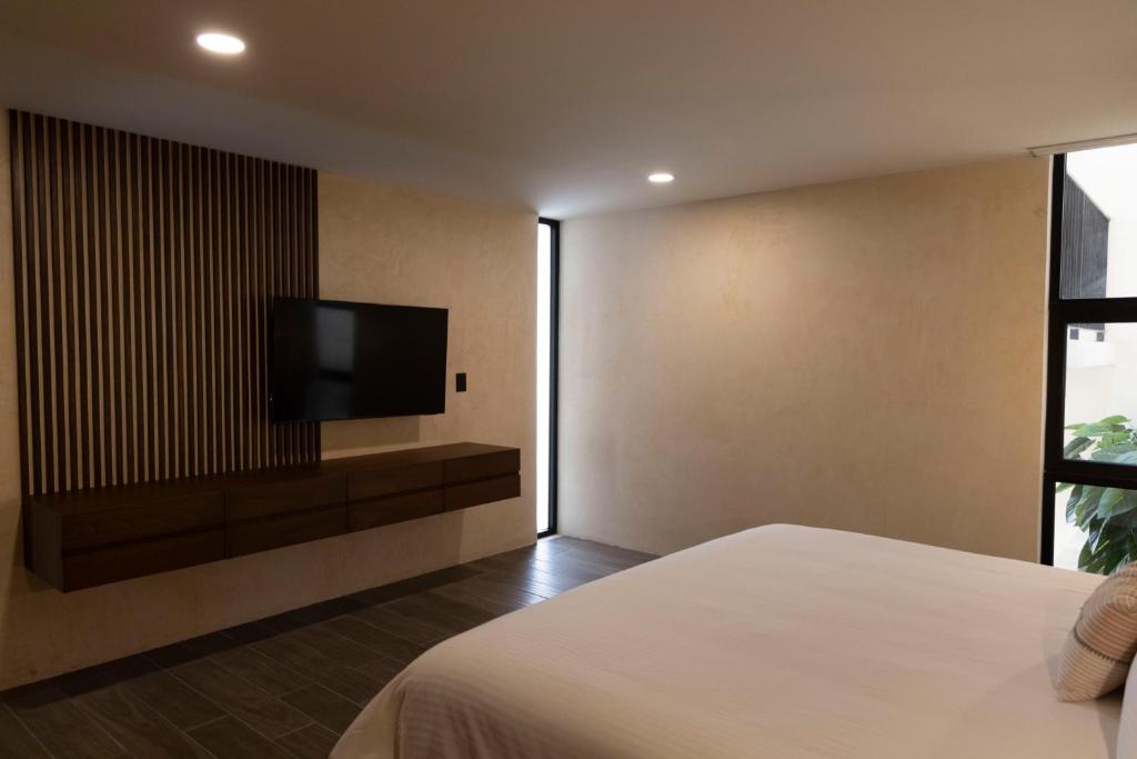 TV a/nebo společenská místnost v ubytování Moreira Hotel Boutique