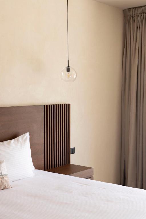 Postel nebo postele na pokoji v ubytování Moreira Hotel Boutique