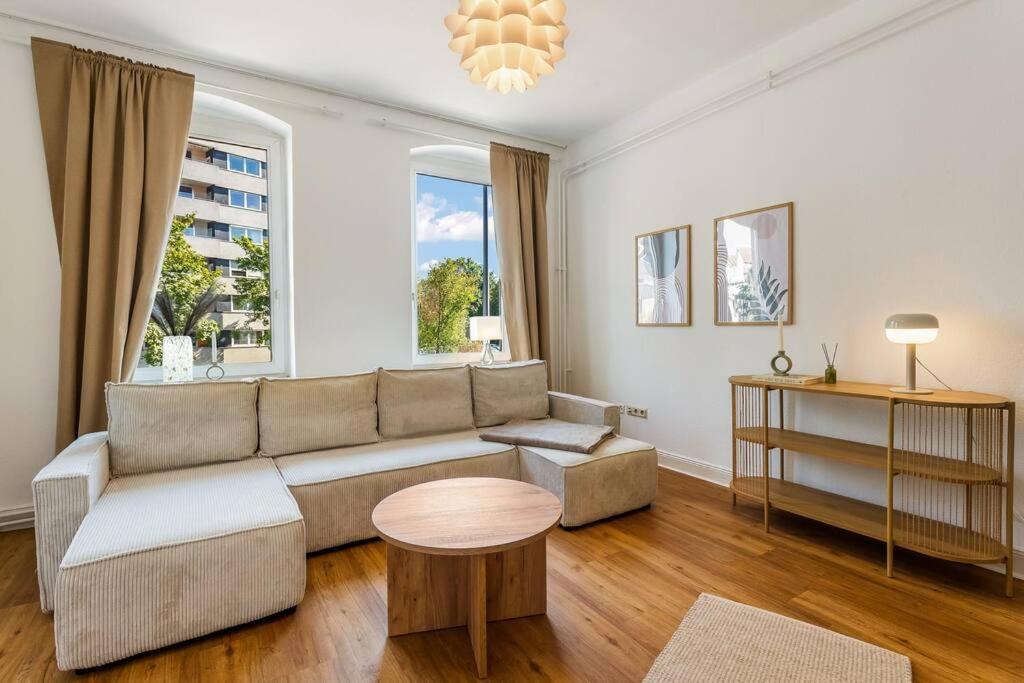 a living room with a couch and a table at MARBURGER Zentral, bis 8 Personen, WLAN, Netflix in Marburg an der Lahn