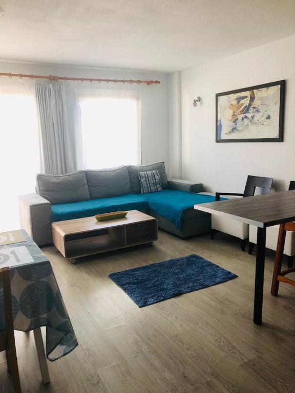 A seating area at First Line Beach Apartment with Ocean View La Arena