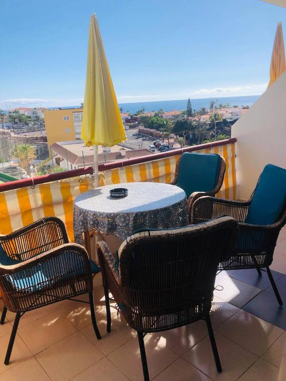 A balcony or terrace at First Line Beach Apartment with Ocean View La Arena