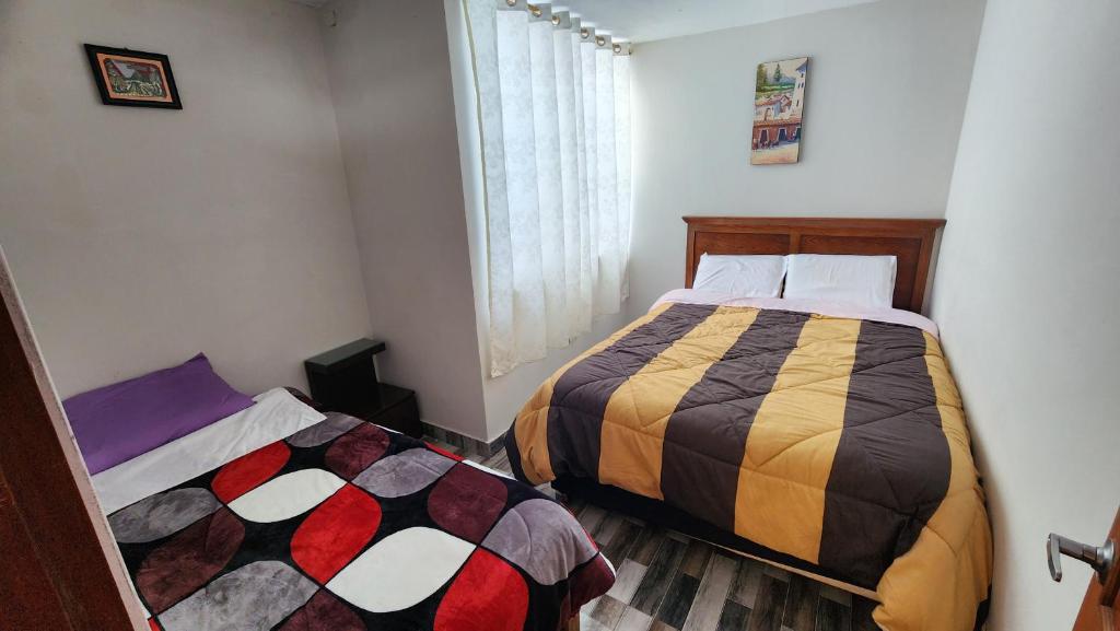 Postel nebo postele na pokoji v ubytování TRANSFER VIP HOSTEL