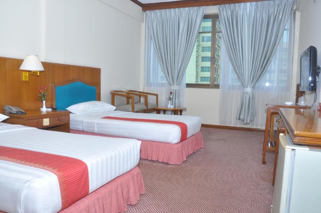 Postel nebo postele na pokoji v ubytování Panorama Hotel
