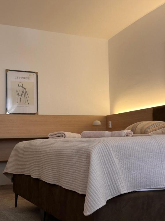 Postel nebo postele na pokoji v ubytování Apartmány Reduta - new