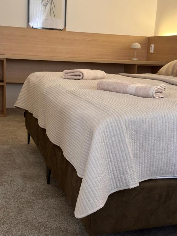 Postel nebo postele na pokoji v ubytování Apartmány Reduta - new