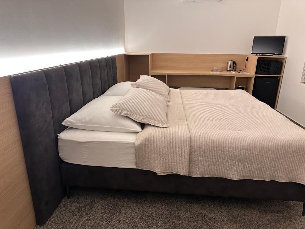 Postel nebo postele na pokoji v ubytování Apartmány Reduta - new
