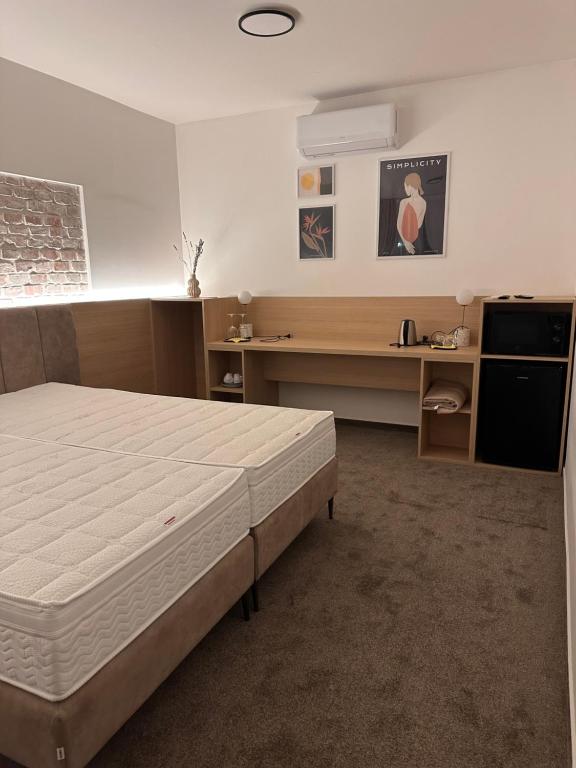 Postel nebo postele na pokoji v ubytování Apartmány Reduta - new