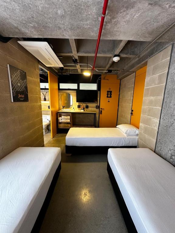 Postel nebo postele na pokoji v ubytování Cytrico Hotel Laureles Estadio