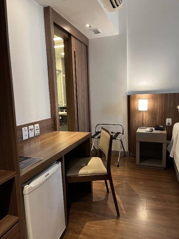 Cama ou camas em um quarto em Hotel Vivenzo Savassi Belo Horizonte