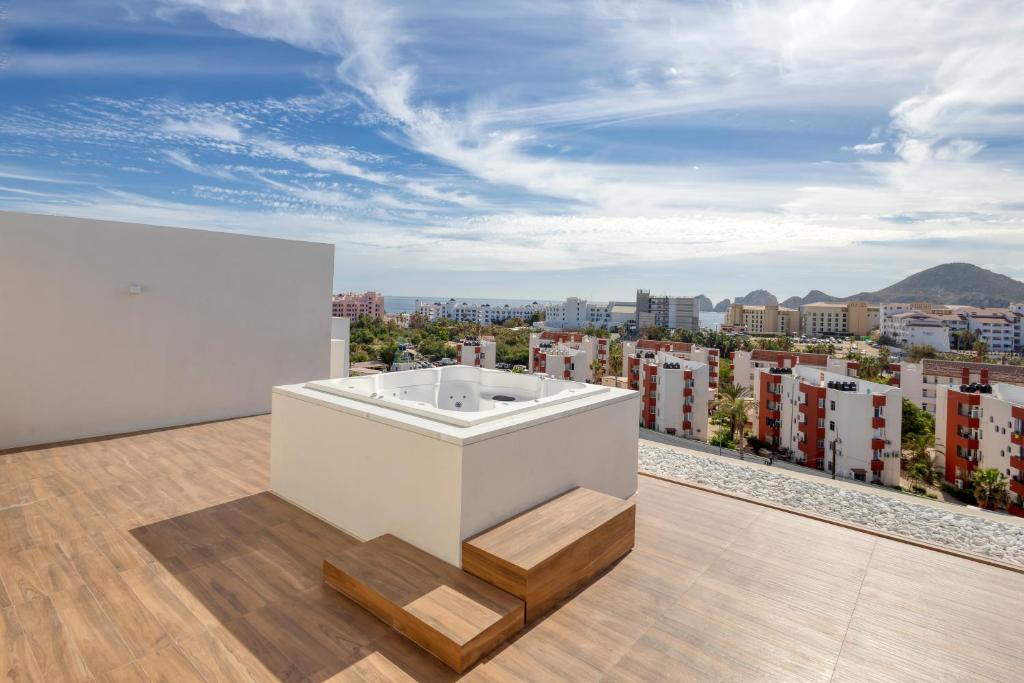 a bath tub on the roof of a building at Lumina at Marea Cabo San Lucas in Cabo San Lucas