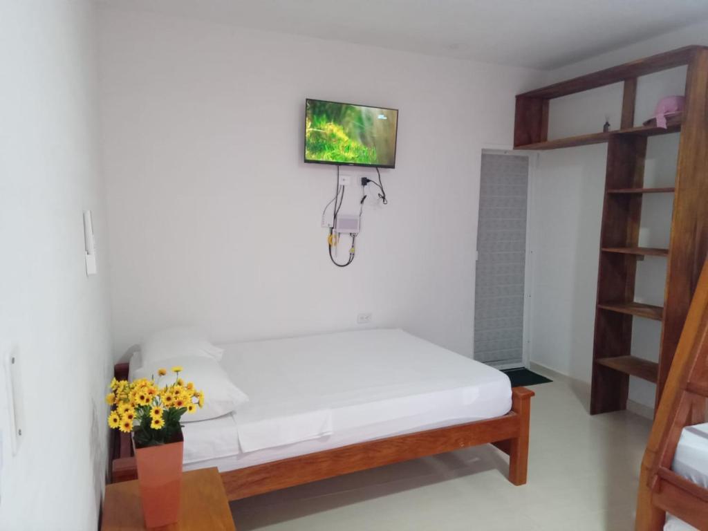 Postel nebo postele na pokoji v ubytování Apartamentos Datalu