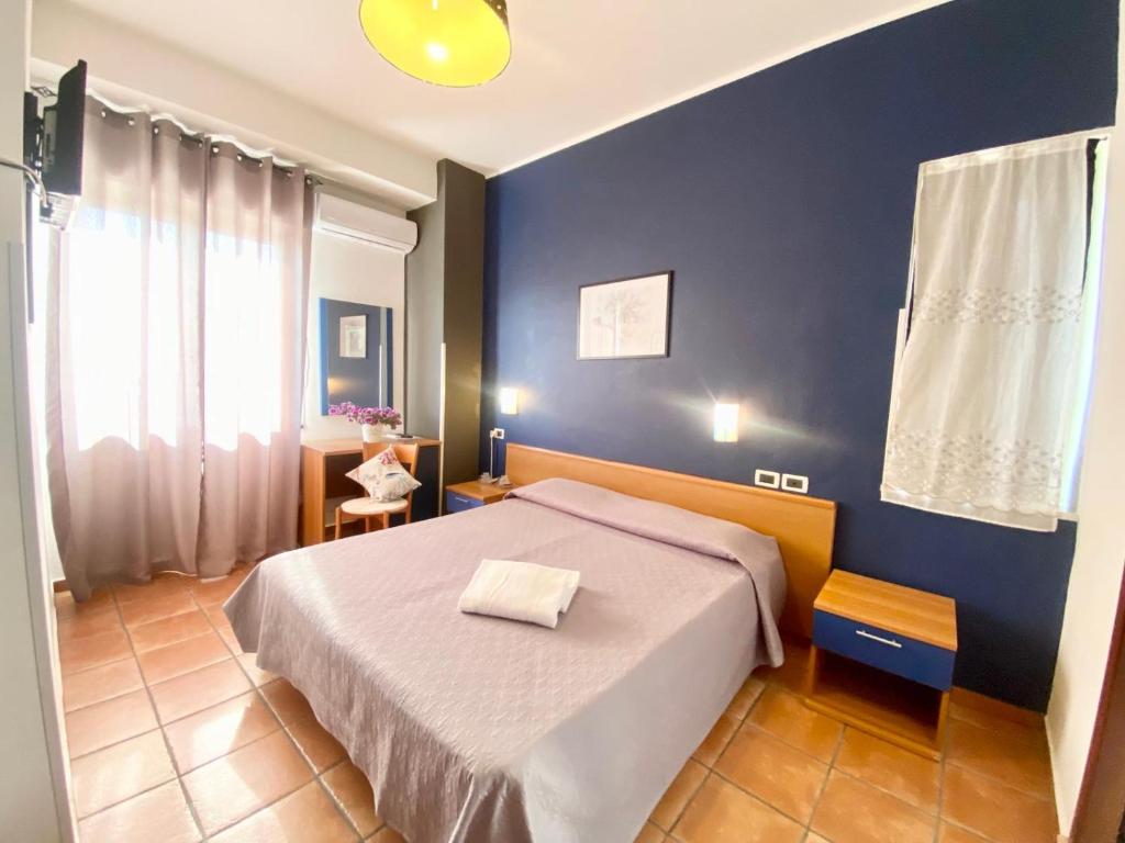 Postel nebo postele na pokoji v ubytování Hotel Praja Mare