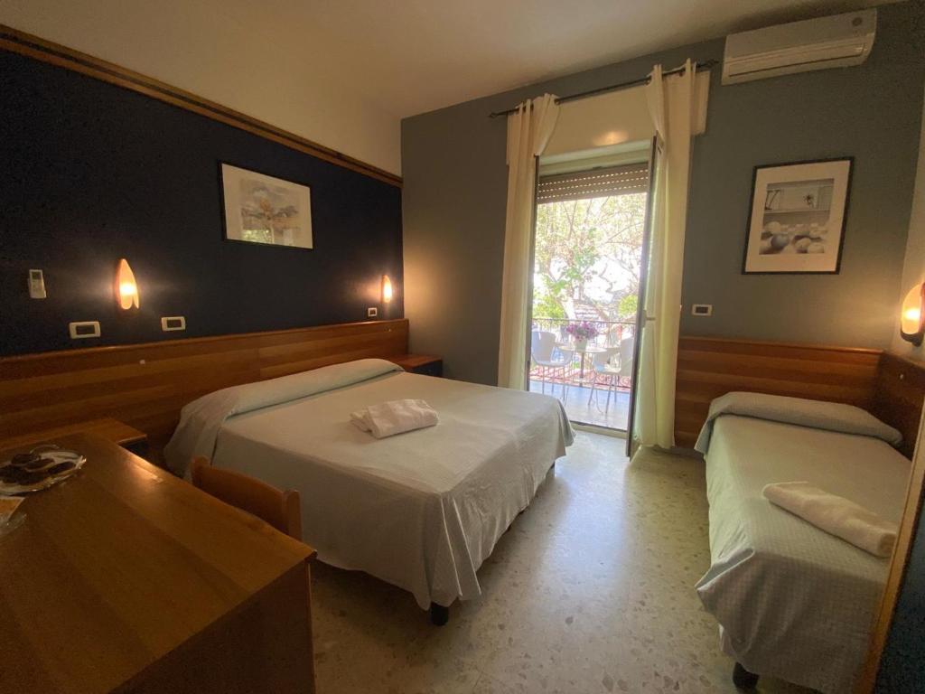 Postel nebo postele na pokoji v ubytování Hotel Praja Mare
