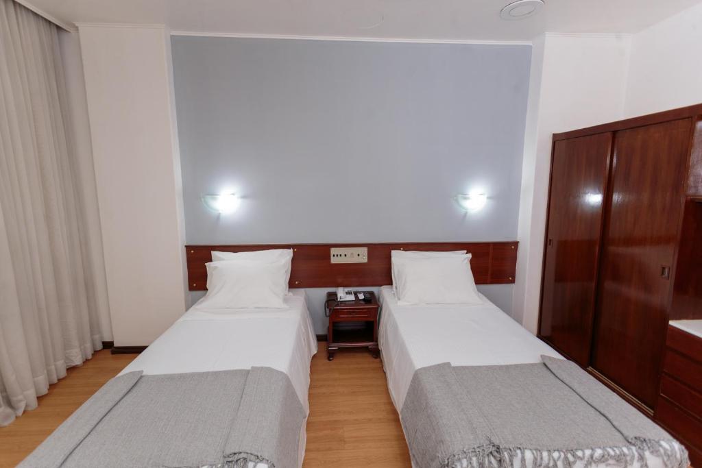 Postel nebo postele na pokoji v ubytování City Hotel by Fast10