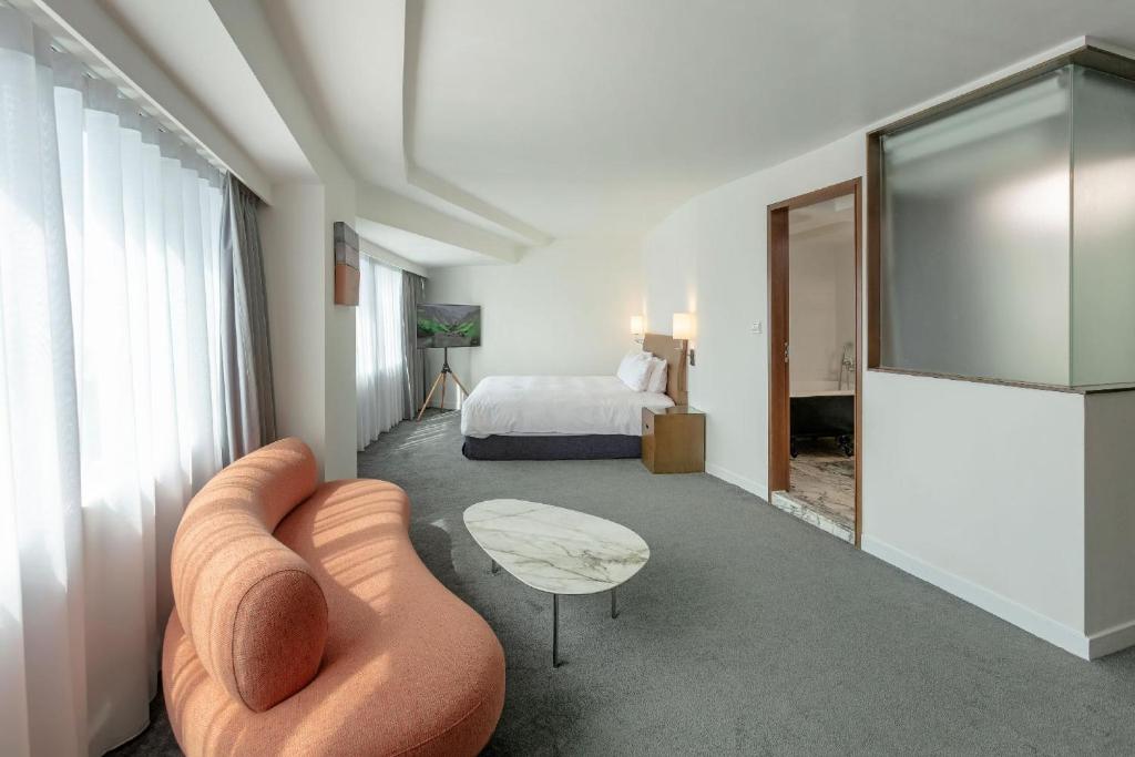 Postel nebo postele na pokoji v ubytování United Hotel