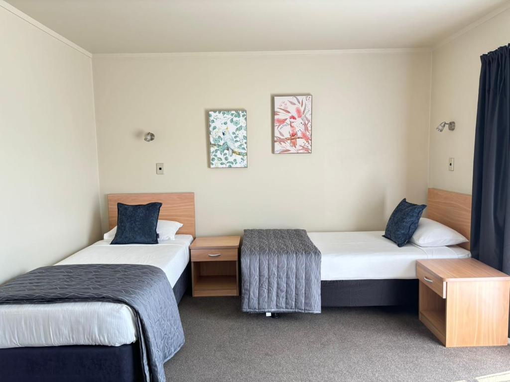 Postel nebo postele na pokoji v ubytování Arcadia Motel