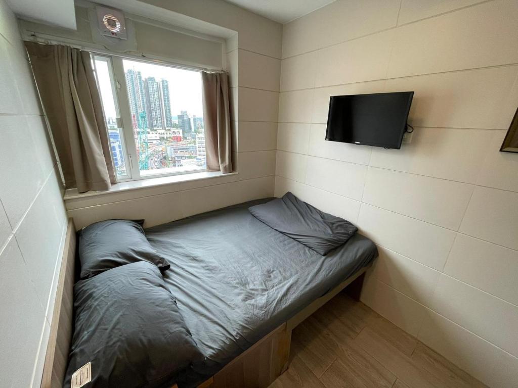 Letto o letti in una camera di 香港榆臨賓館 Yulam Guesthouse