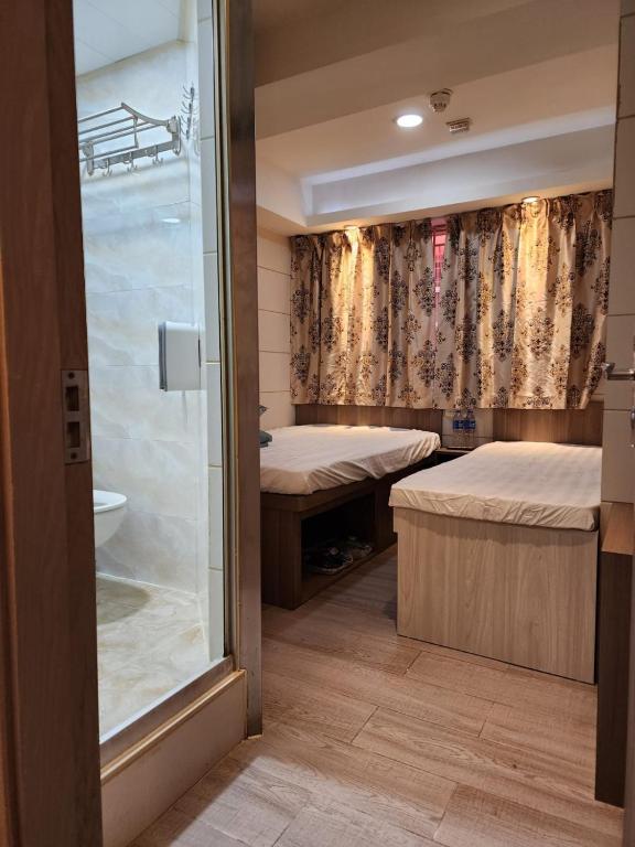 Letto o letti in una camera di 香港榆臨賓館 Yulam Guesthouse