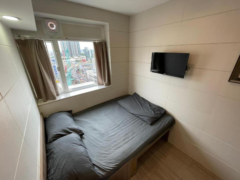 TV o dispositivi per l'intrattenimento presso 香港榆臨賓館 Yulam Guesthouse