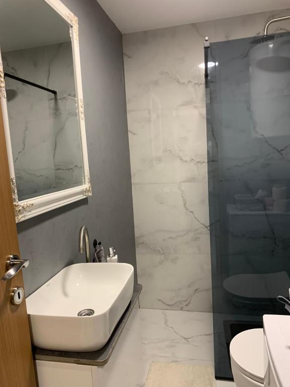 Kopalnica v nastanitvi Urban Apartman-privatan parking-