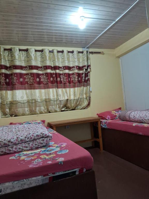 Postel nebo postele na pokoji v ubytování Mountain View Lodge