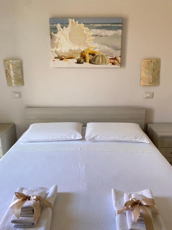 Postel nebo postele na pokoji v ubytování B&B degli Aranci