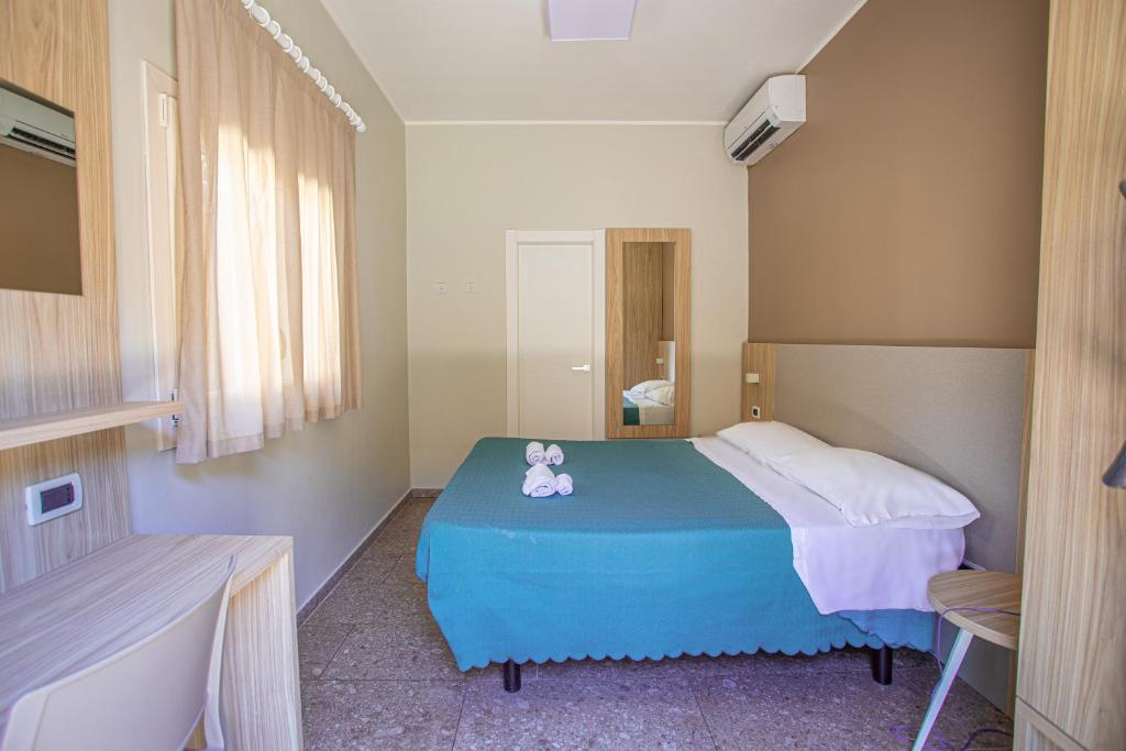 Postel nebo postele na pokoji v ubytování Hotel Tecla