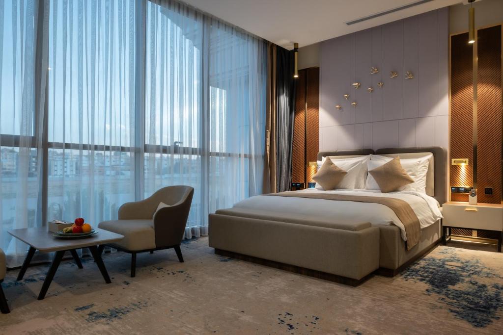Postel nebo postele na pokoji v ubytování Vender Hotel فندق فندر