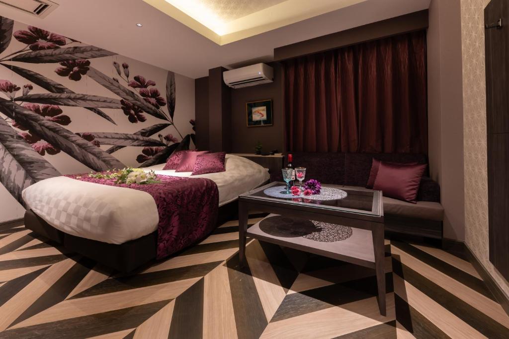 Postel nebo postele na pokoji v ubytování hotel AYA Adult Only