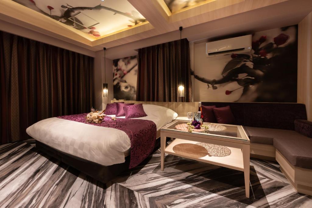 Postel nebo postele na pokoji v ubytování hotel AYA Adult Only