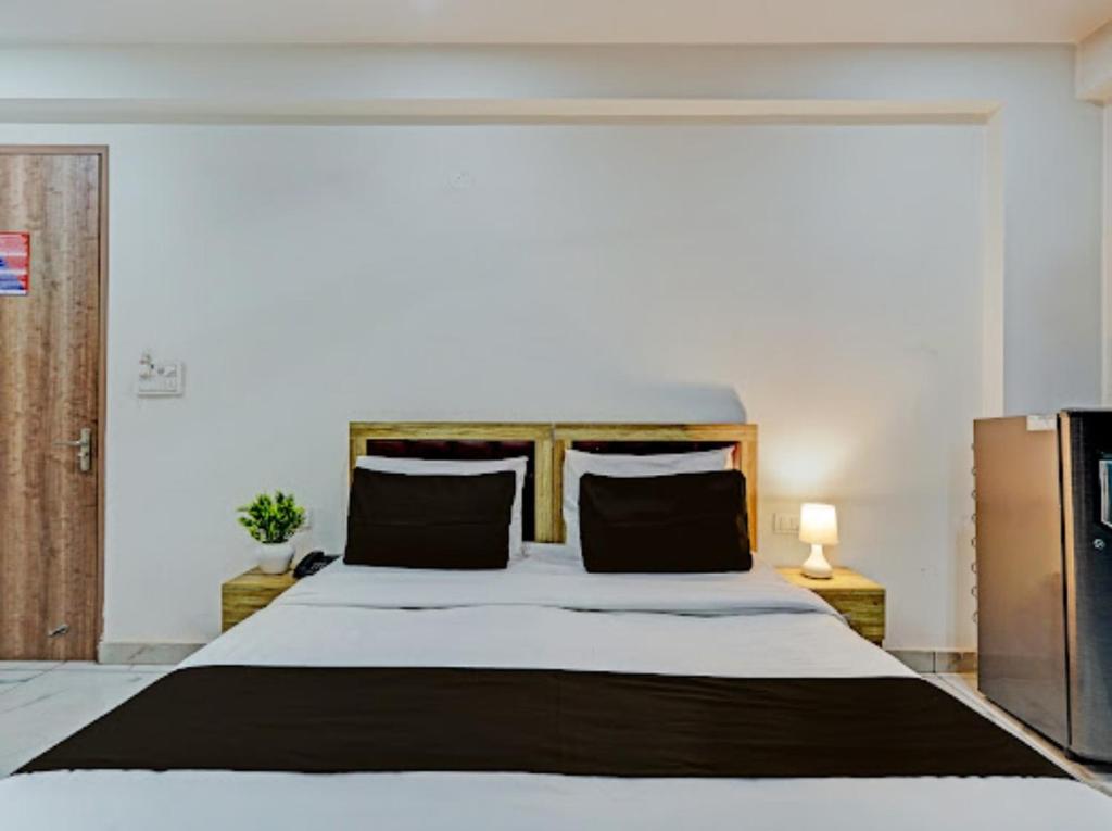 Postel nebo postele na pokoji v ubytování Akshay dream stay