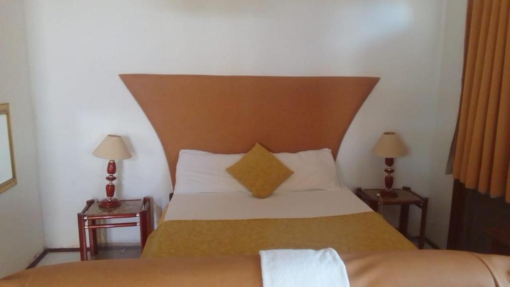 Postel nebo postele na pokoji v ubytování Residencial Cabo Verde Palace