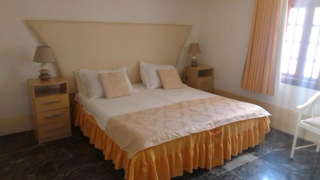 Postel nebo postele na pokoji v ubytování Residencial Cabo Verde Palace