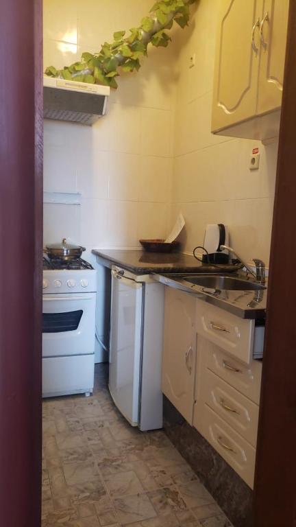 Kuchyň nebo kuchyňský kout v ubytování Residencial Cabo Verde Palace