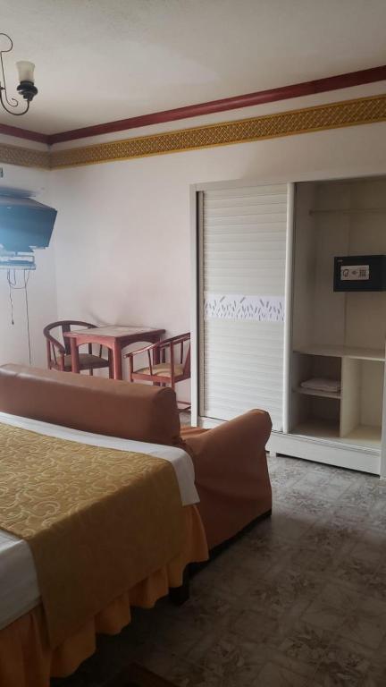 Postel nebo postele na pokoji v ubytování Residencial Cabo Verde Palace