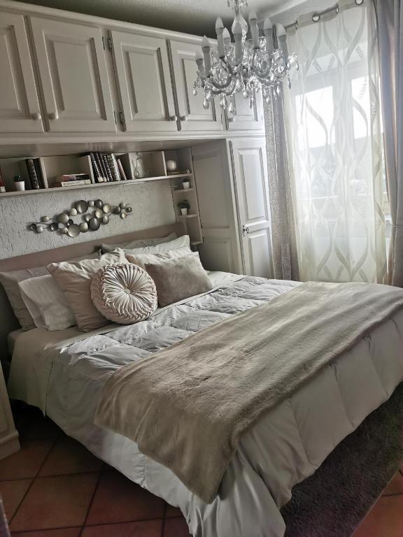 Postel nebo postele na pokoji v ubytování Ancienne Maisonnette
