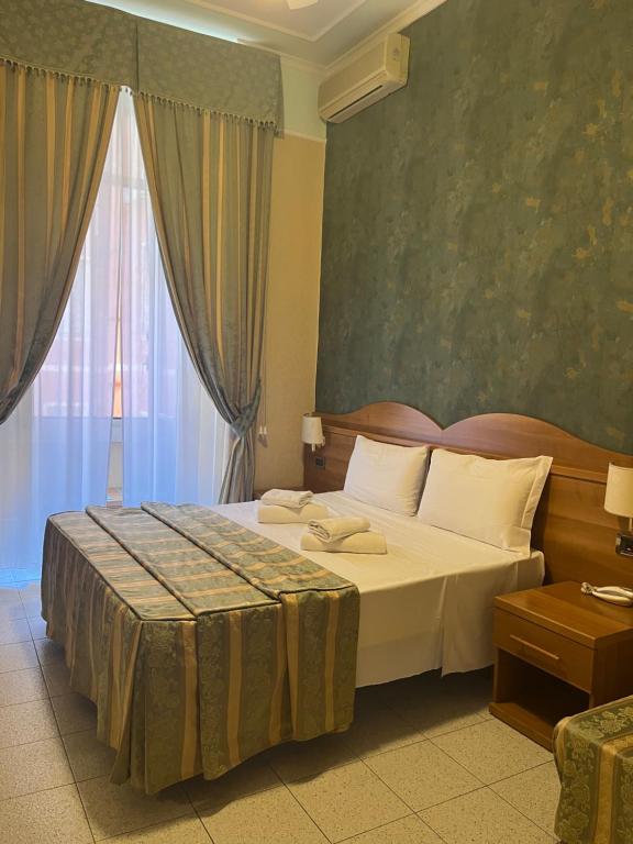 Postel nebo postele na pokoji v ubytování Hotel Teti