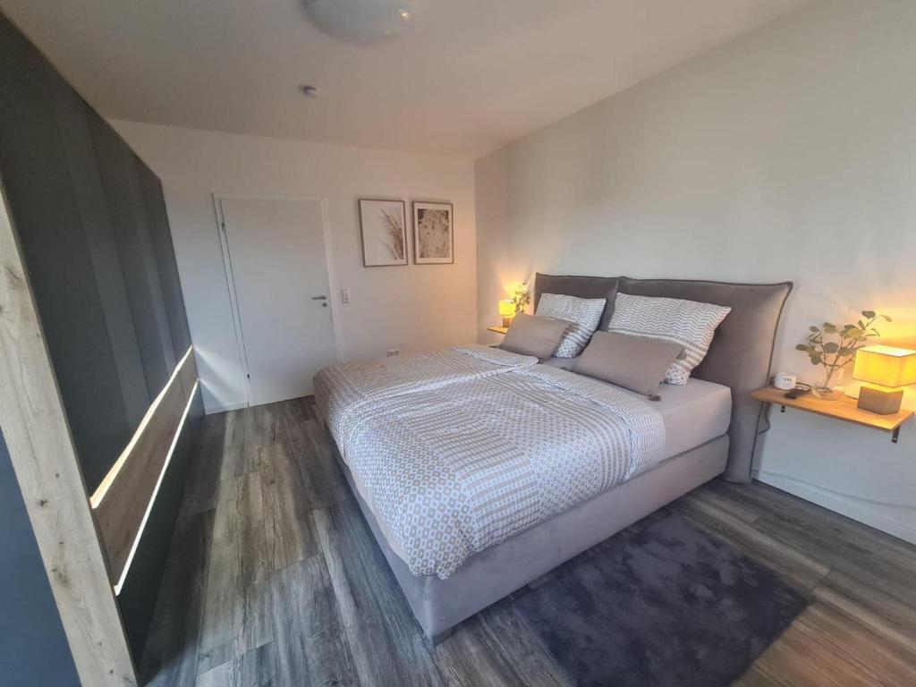 a bedroom with a large bed in a room at Premium Apartment am Rande des Pfälzer Waldes in Ramstein-Miesenbach