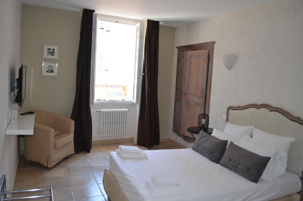 Postel nebo postele na pokoji v ubytování Hôtel du Parc
