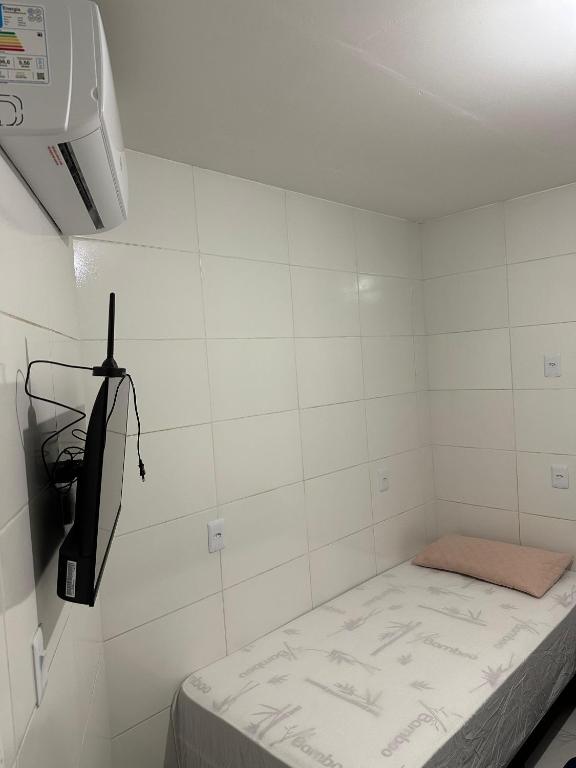 Postel nebo postele na pokoji v ubytování Cantinho Aconchegante- Quarto 03 Família - com AR