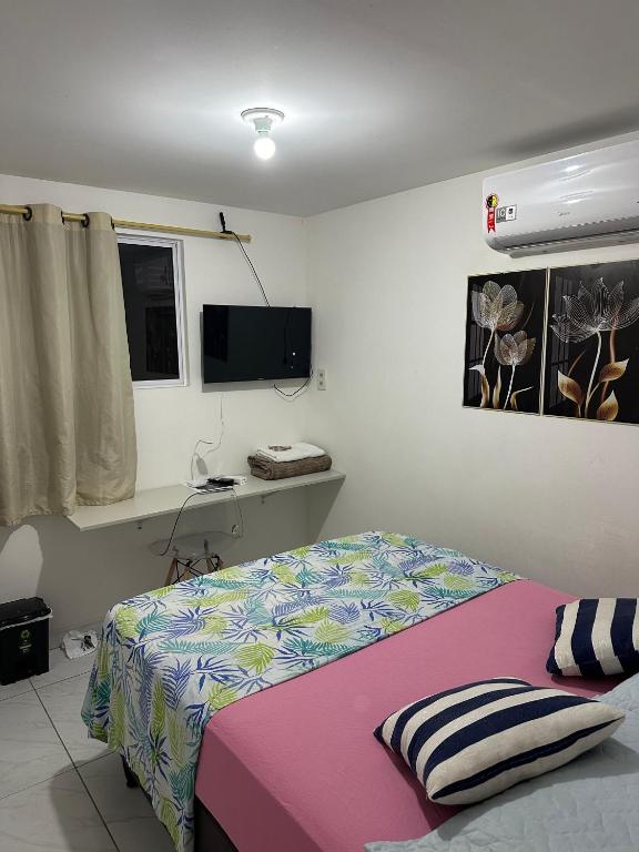 Voodi või voodid majutusasutuse Cantinho aconchegante - Quarto 02 AR-condicionado toas